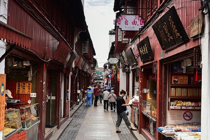 4-Hour Qibao Ancient Water Town Private Tour with Metro Experience - Stop 2: Qibao Old Street, canal lanes, lanterns, and guided snack energy