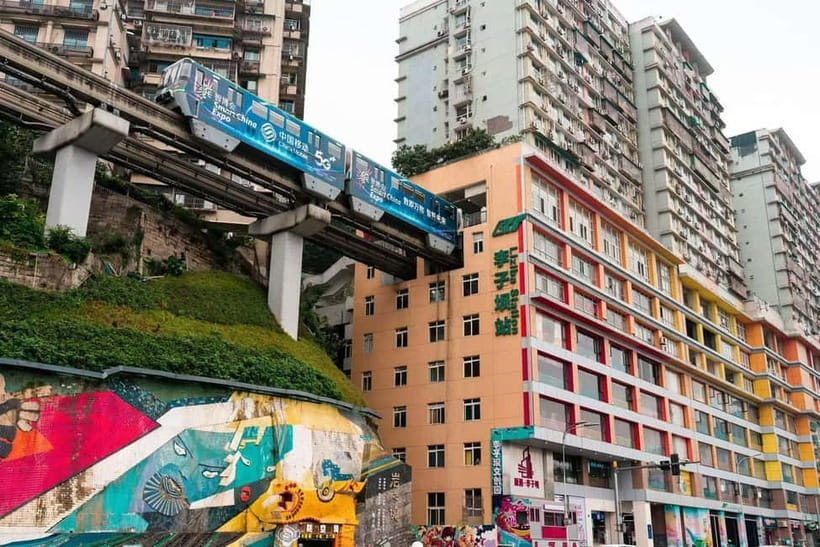 Chongqing: Surreal Urban, Ancient Town, and Secret Viewpoint - Liziba Monorail: Seeing the Train Cut Through Apartment Life