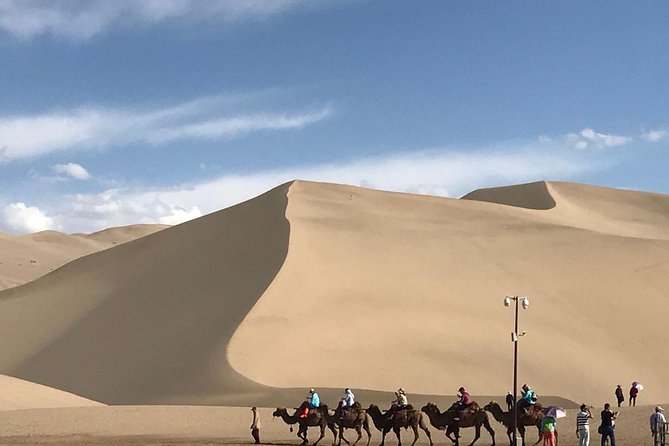 Dunhuang Private Day Tour Mogao Grottoes, Singing Dunes and Crescent Moon Spring - Mingsha Shan Singing Dunes: short stop, memorable effect