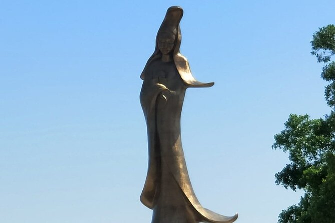 Full Day Macau Sightseeing Tour - Kum Iam Statue and Old Hotel Central: Mercy and Colonial-Era Echoes