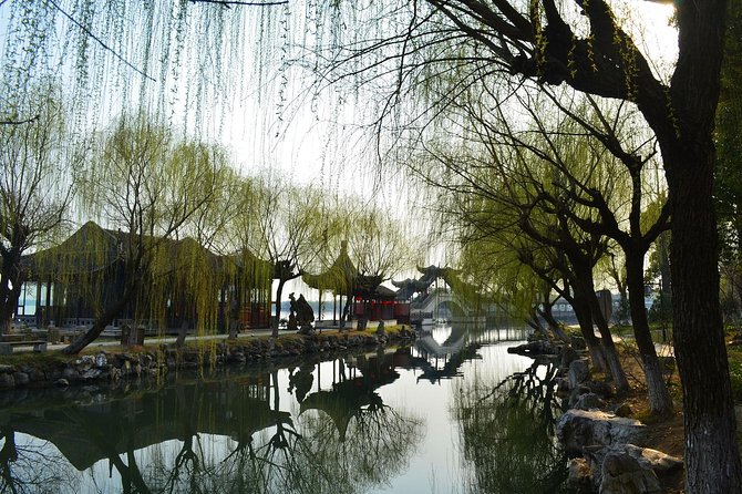 Mini Group: One-Day Zhouzhuang and Jinxi Water Town Tour - Touring Shen House and other courtyard houses in Zhouzhuang