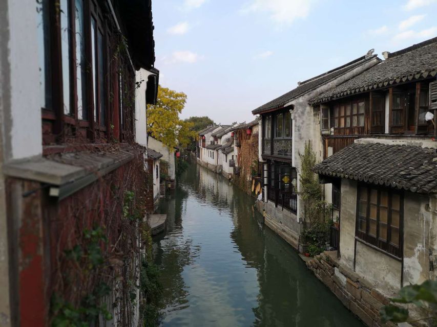 Su Zhou and Zhou Zhuang Water Village Day Tour - Getting to Suzhou: Air-Conditioned Comfort and Guided Orientation